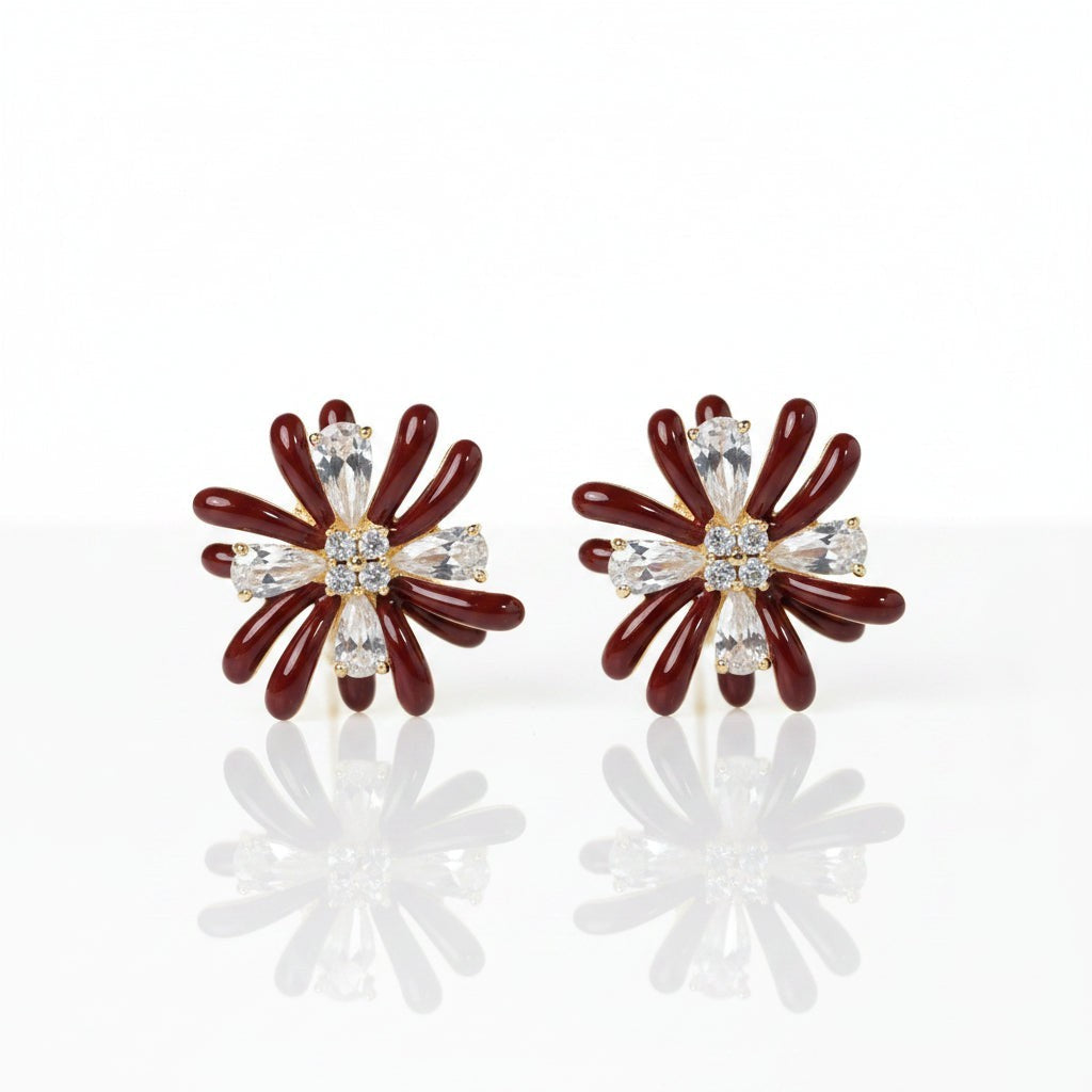SVORA Marron Flower Crystal Stud Earrings with dark maroon enamel petals and clear baguette crystals.