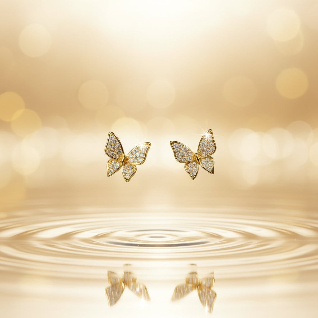 SVORA mini gold butterfly stud earrings with cubic zirconia stones, 18K gold tone plating.