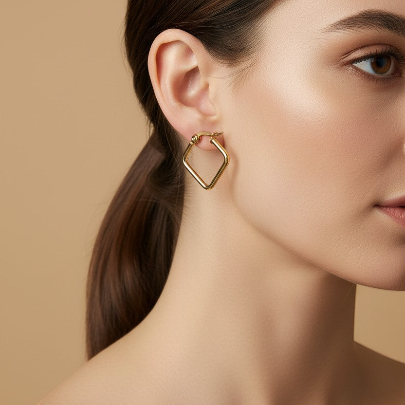 SVORA gold-plated stainless steel minimal square hoop earrings on model.