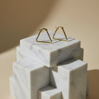 SVORA minimalist gold triangle hoop earrings made of stainless steel with 18K gold plating.