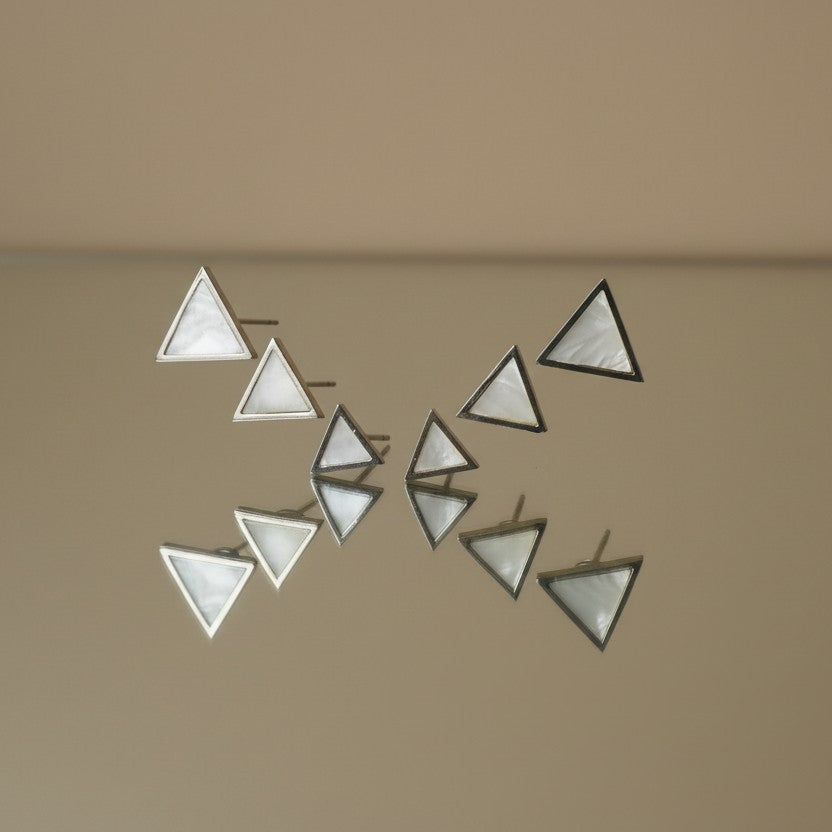 SVORA set of 3 minimalist triangle stud earrings with white iridescent stone inlay and silver-tone metal.