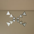 SVORA set of 3 minimalist triangle stud earrings with white iridescent stone inlay and silver-tone metal.