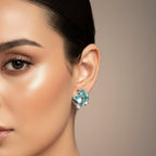 SVORA Moon Aqua Stud Earrings with cushion-cut crystal, crescent moon, and pavé stars. Gold-tone stainless steel.