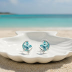 SVORA aqua cushion-cut crystal stud earrings with silver-tone crescent moon and pavé stars.