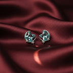 SVORA Moon Aqua Stud Earrings with cushion-cut aqua crystals, crescent moon, and pavé stars. Stainless steel.