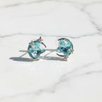 SVORA aqua cushion-cut crystal stud earrings with silver-tone crescent moon and pavé stars.