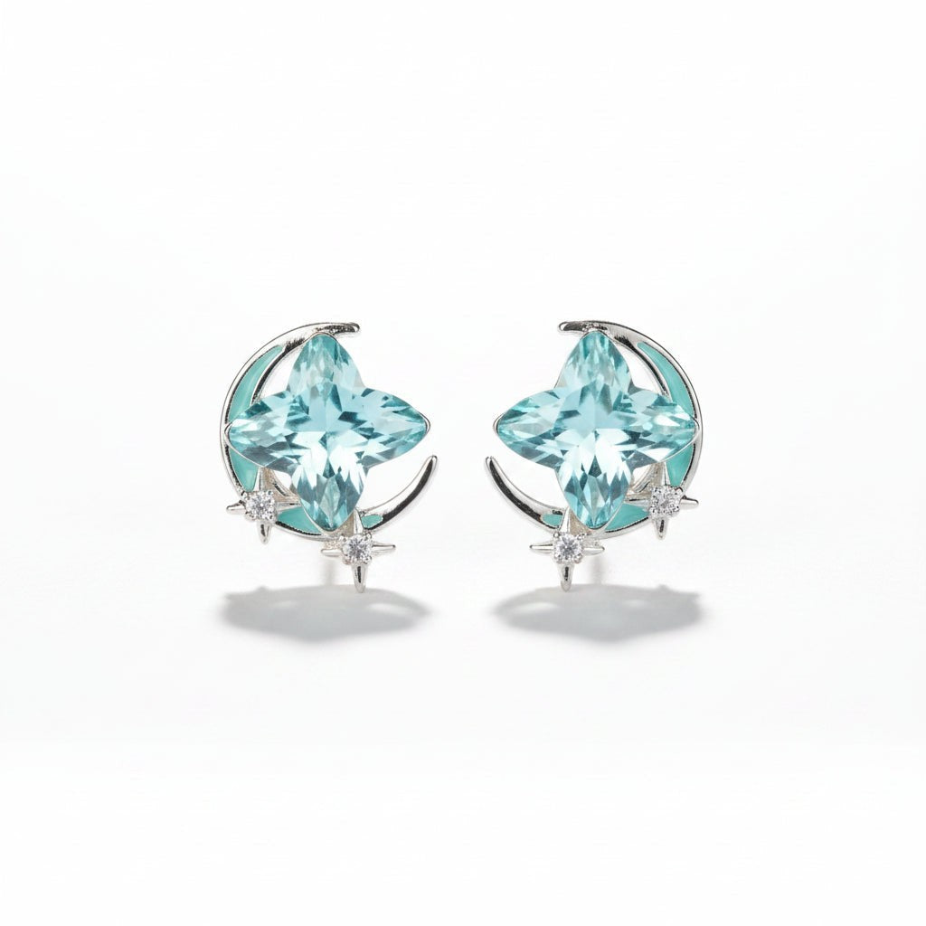 SVORA aqua cushion-cut crystal stud earrings with silver-tone crescent moon and pavé stars.