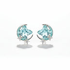 SVORA aqua cushion-cut crystal stud earrings with silver-tone crescent moon and pavé stars.