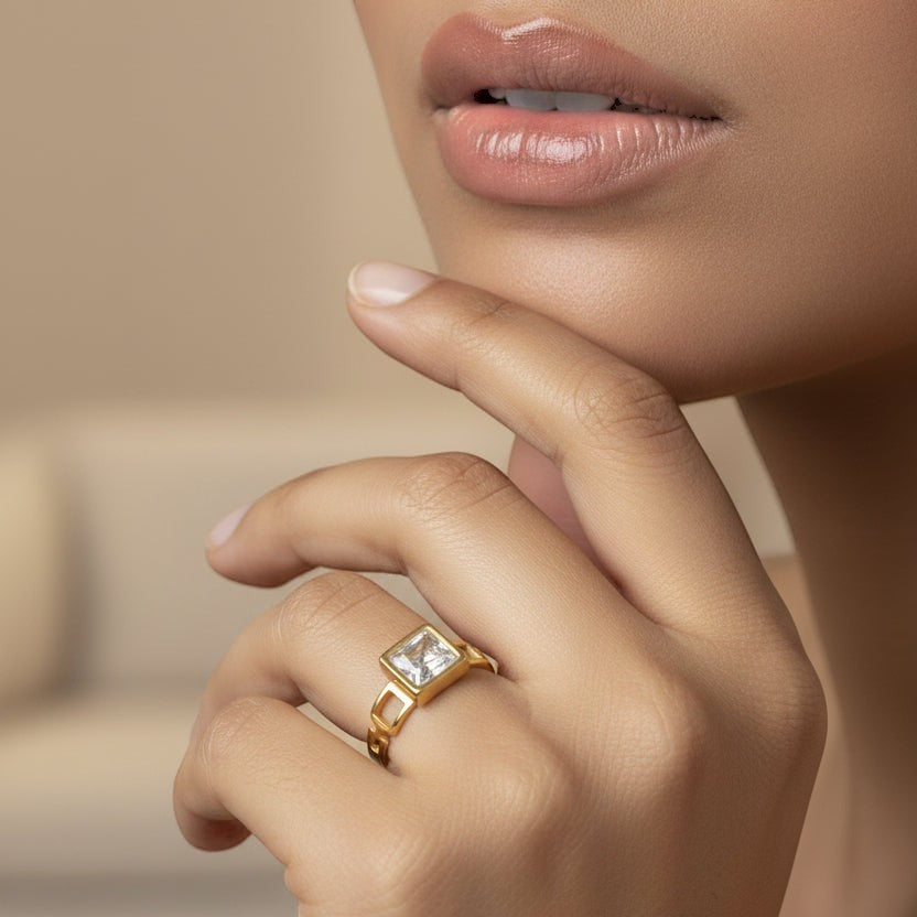 SVORA gold plated stainless steel Mosaic Lumiere Square Ring with a clear square-cut stone and open square links.