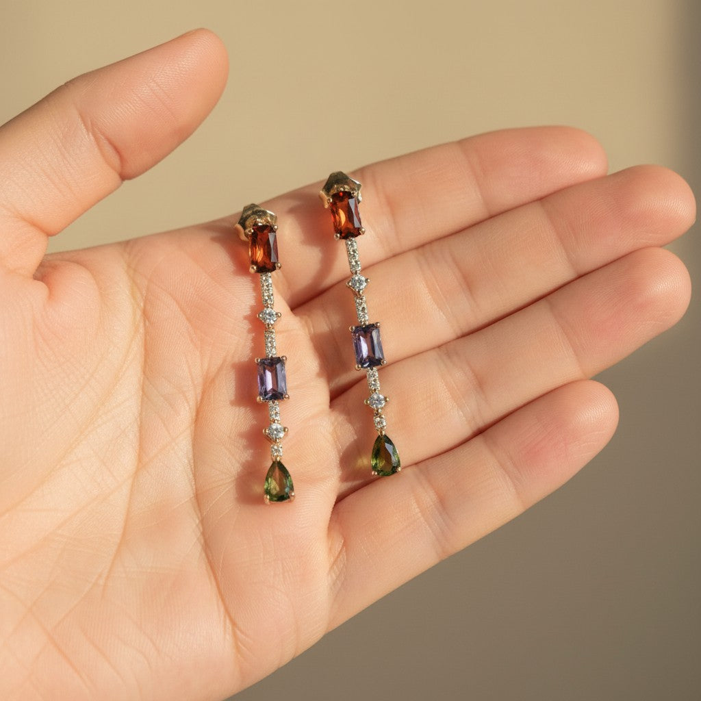 SVORA multicolor gemstone drop earrings with ruby, amethyst, and emerald stones, accented with pavé crystals. 18k gold plated.