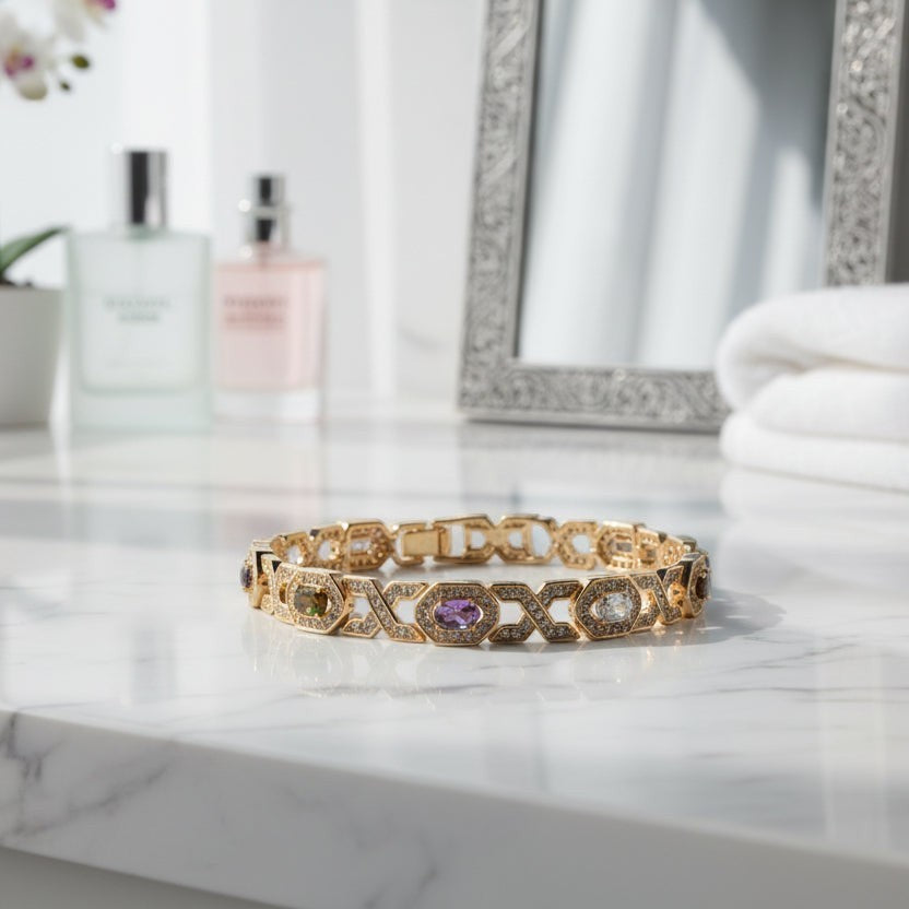 SVORA multicolor halo bracelet with oval CZs in amethyst, garnet, peridot, and white, set in 18K rose gold plated stainless steel.