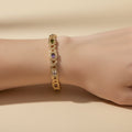 SVORA multicolor halo bracelet with oval CZs in amethyst, green, and white on rose gold plated stainless steel.