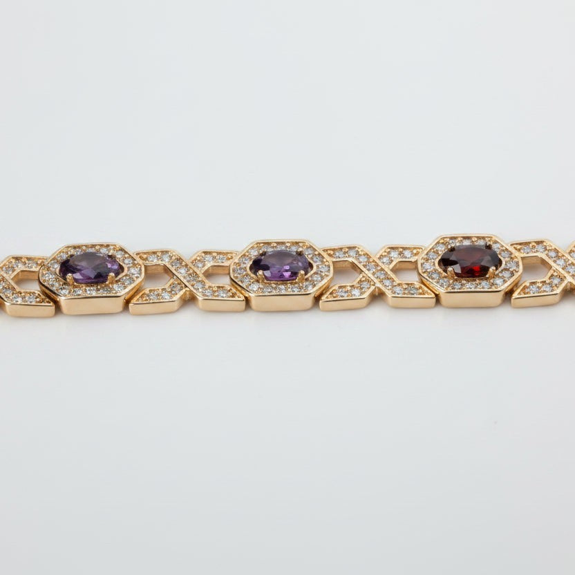 SVORA rose gold plated bracelet with hexagonal halo links set with oval CZs in amethyst and garnet colours, surrounded by small white CZs.