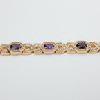SVORA rose gold plated bracelet with hexagonal halo links set with oval CZs in amethyst and garnet colours, surrounded by small white CZs.