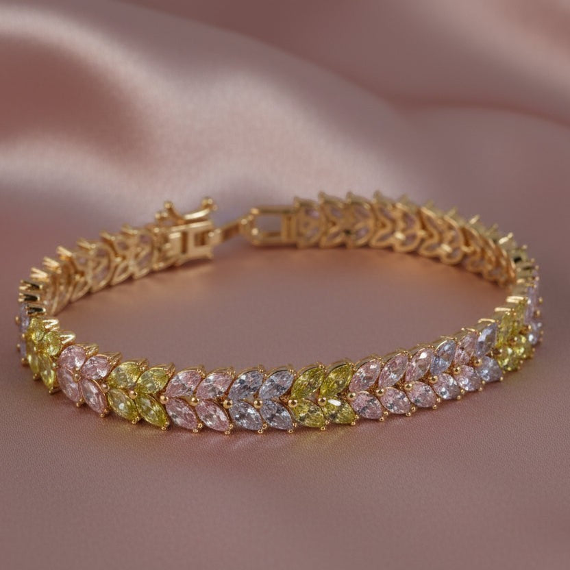 SVORA multicolor pastel tennis bracelet with marquise CZ stones in pink, lavender, and mint on a gold-plated stainless steel band.