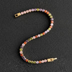 SVORA multicolor tennis bracelet with colorful crystals and gold clasp, made of stainless steel.