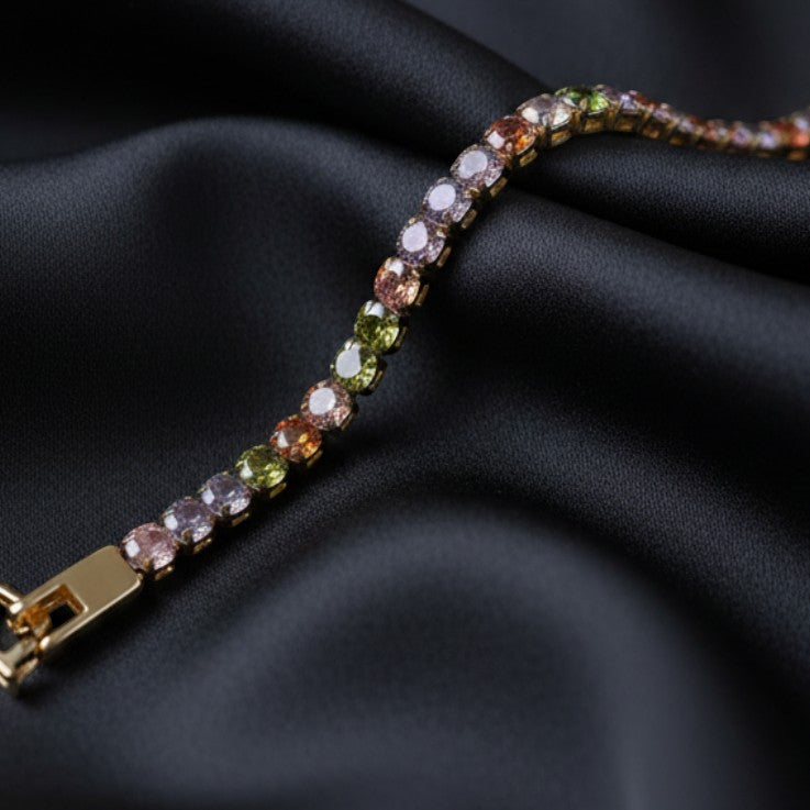 SVORA multicolor tennis bracelet with colorful crystals on a gold-tone stainless steel band, adjustable clasp.