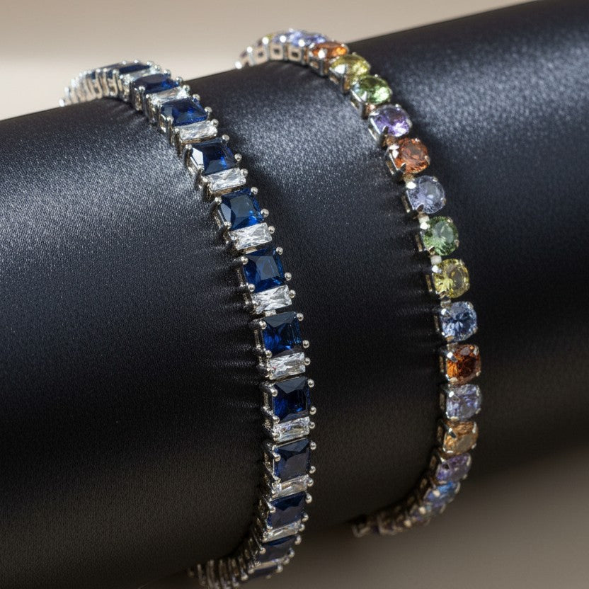 SVORA multicolor tennis bracelet with rainbow-colored crystals and gold-tone plating. Adjustable.