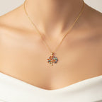 SVORA gold plated stainless steel necklace with a multicolor Tree of Life pendant featuring amber, blue, turquoise, and amethyst CZ stones.