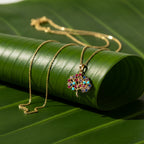 SVORA gold plated stainless steel necklace with a multicolor Tree of Life pendant featuring amber, blue, turquoise, and amethyst CZ stones.