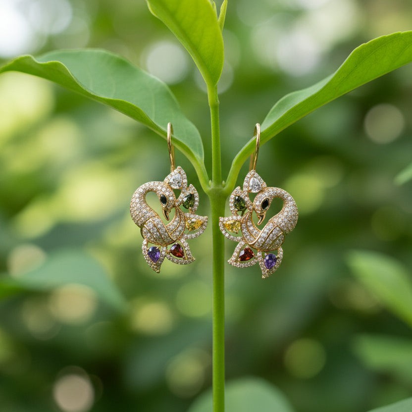 SVORA gold-tone peacock stud earrings with multicolour cubic zirconia stones in green, yellow, red, purple, and clear.