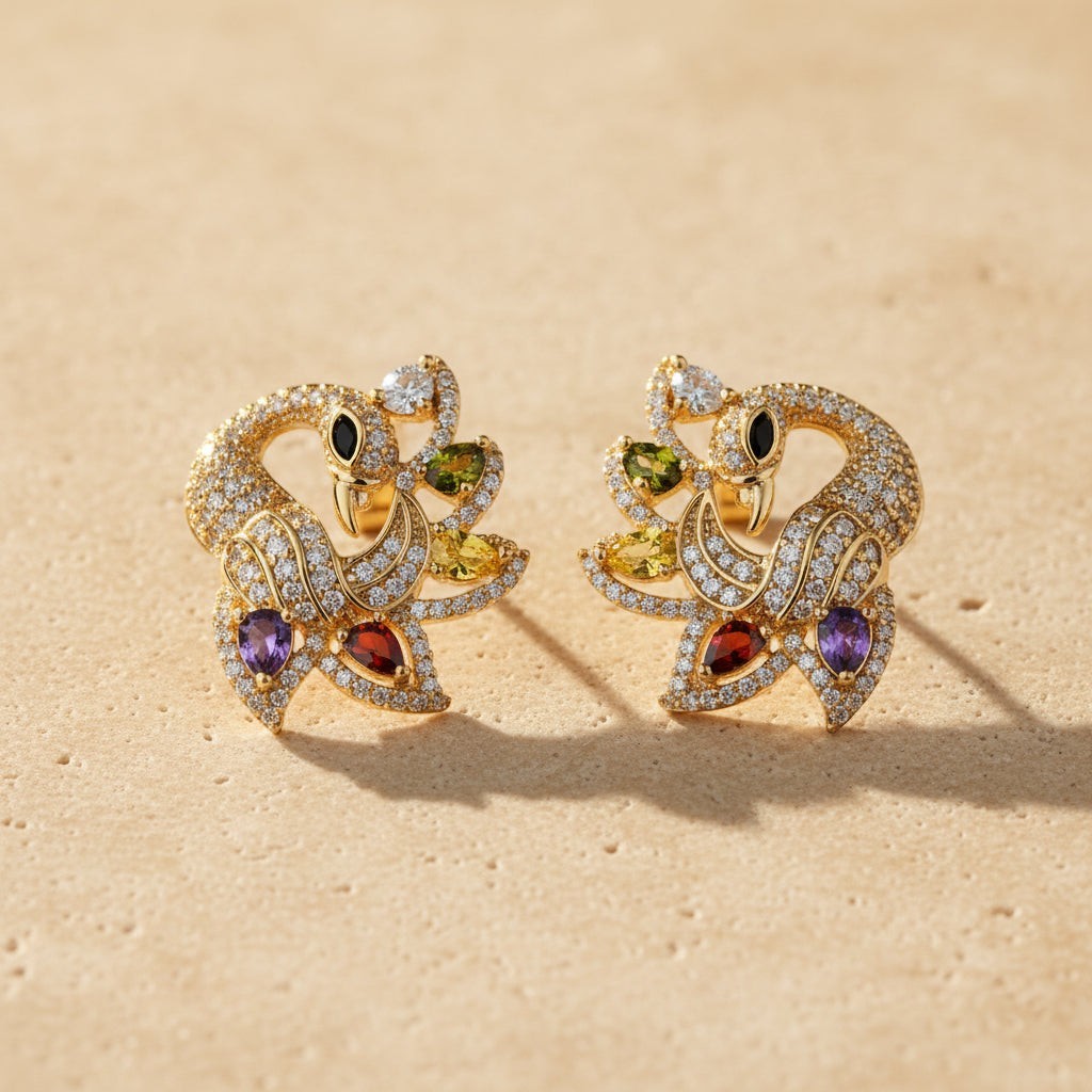 SVORA gold-tone peacock stud earrings with multicolour cubic zirconia stones in green, yellow, red, purple, and clear.