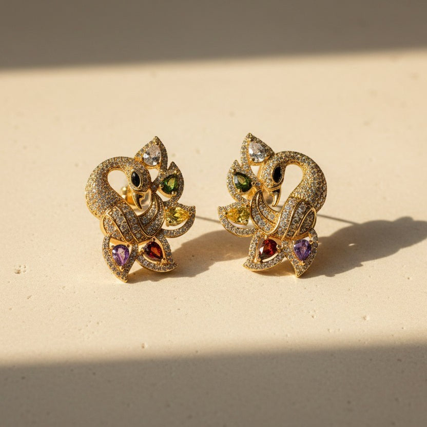 SVORA gold-tone peacock stud earrings with multicolour cubic zirconia stones.