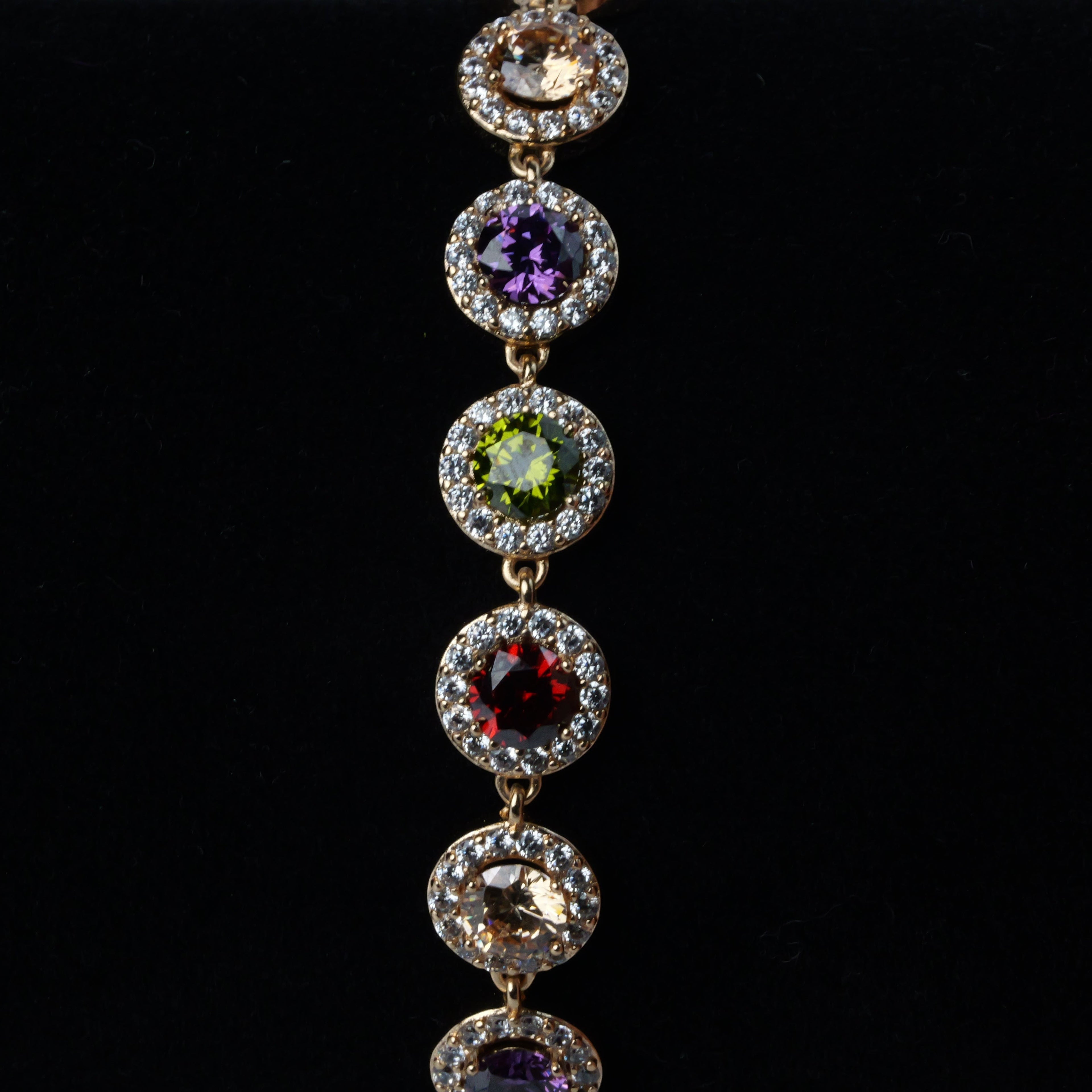SVORA multicolour round tennis bracelet with halo of white cubic zirconia, rose gold plated stainless steel.