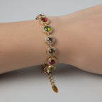 SVORA multicolour round tennis bracelet with halo cubic zirconia on rose gold chain. Adjustable lobster clasp.