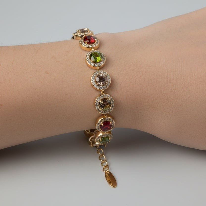 SVORA multicolour round tennis bracelet with halo cubic zirconia on rose gold chain. Adjustable lobster clasp.