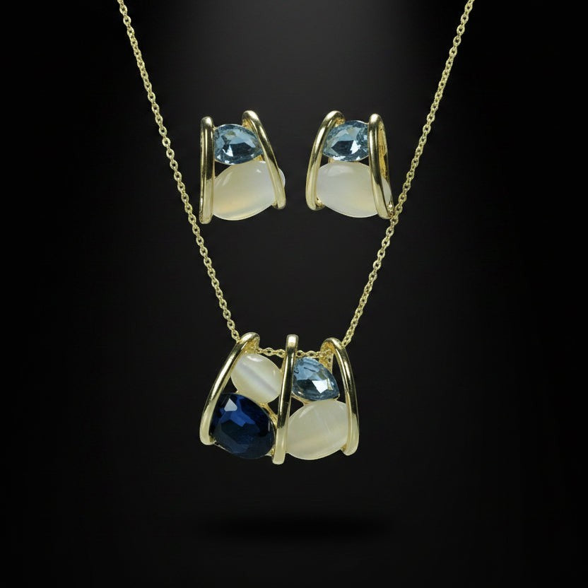 SVORA navy and smoky blue cluster necklace and earrings set with cream cabochons and gold tone metal.