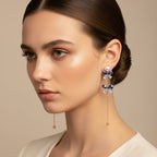 SVORA navy crystal and pearl drop earrings with gold chain and cubic zirconia accents.