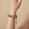 SVORA Noir Mocha Gemstone Adjustable Bracelet with gold-tone finish, mocha, smoky crystal, and black faceted stones.