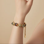 SVORA Noir Mocha Gemstone Adjustable Bracelet with gold-tone finish, mocha, smoky crystal, and black faceted stones.