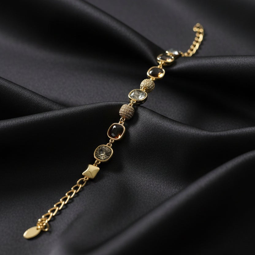 SVORA Noir Mocha Gemstone Adjustable Bracelet with gold-tone finish, mocha stones, smoky crystals, and black faceted details.