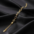 SVORA Noir Mocha Gemstone Adjustable Bracelet with gold-tone finish, mocha stones, smoky crystals, and black faceted details.