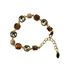 SVORA Noir Mocha Gemstone Adjustable Bracelet with gold-tone finish, featuring mocha-toned stones, smoky crystal accents, and black faceted details.