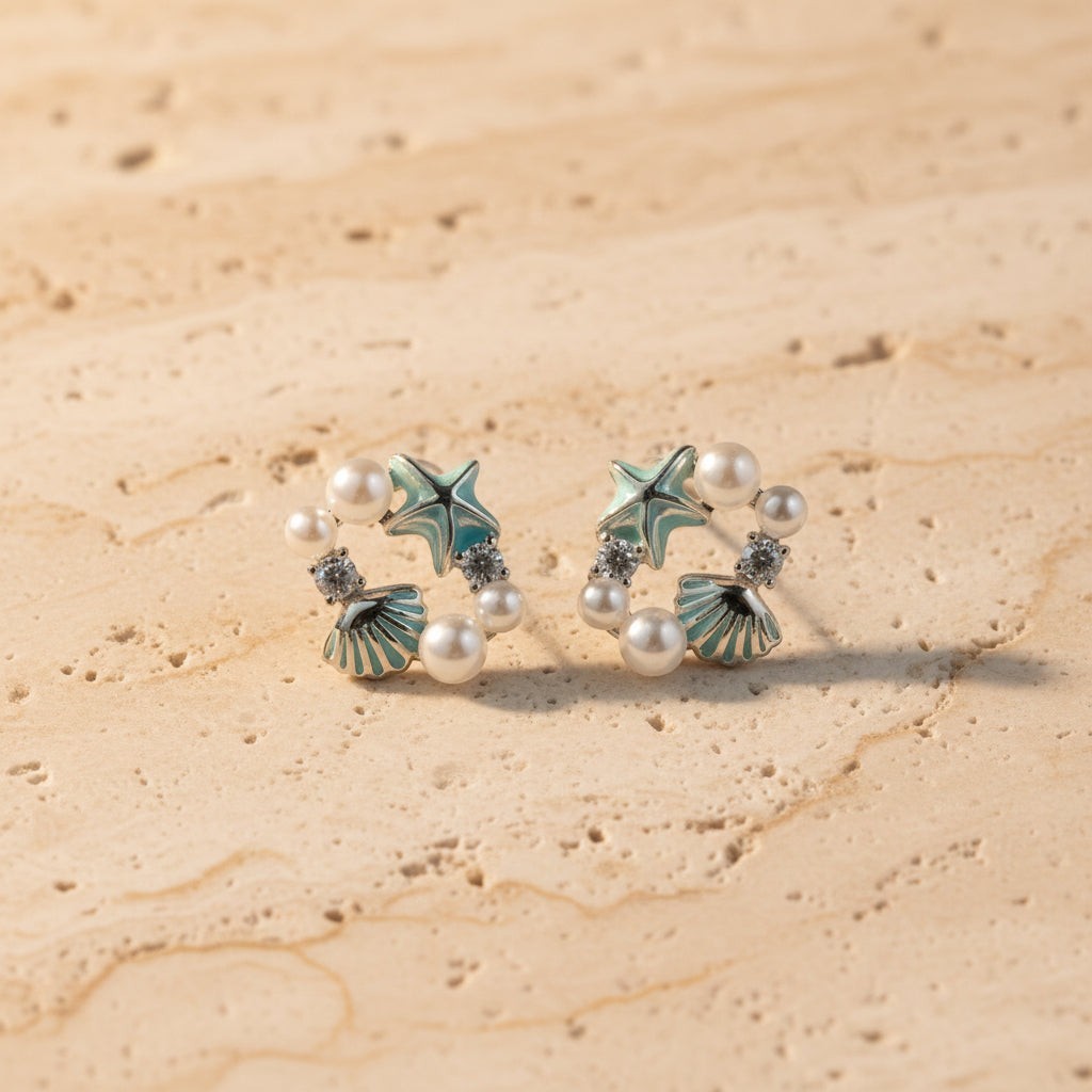 SVORA Ocean Cluster Pearl Stud Earrings with aqua starfish, shells, pearls, and crystals.