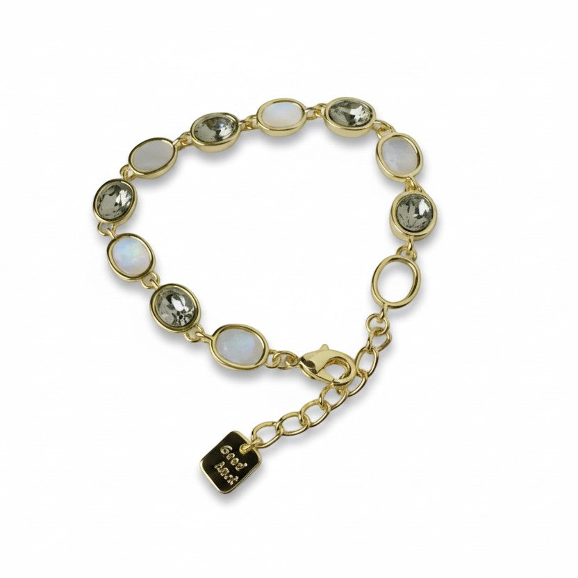 SVORA gold-tone adjustable bracelet with alternating opal grey gemstones and a good luck charm.