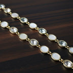 SVORA opal grey gemstone adjustable bracelet with gold-tone finish and good luck charm.