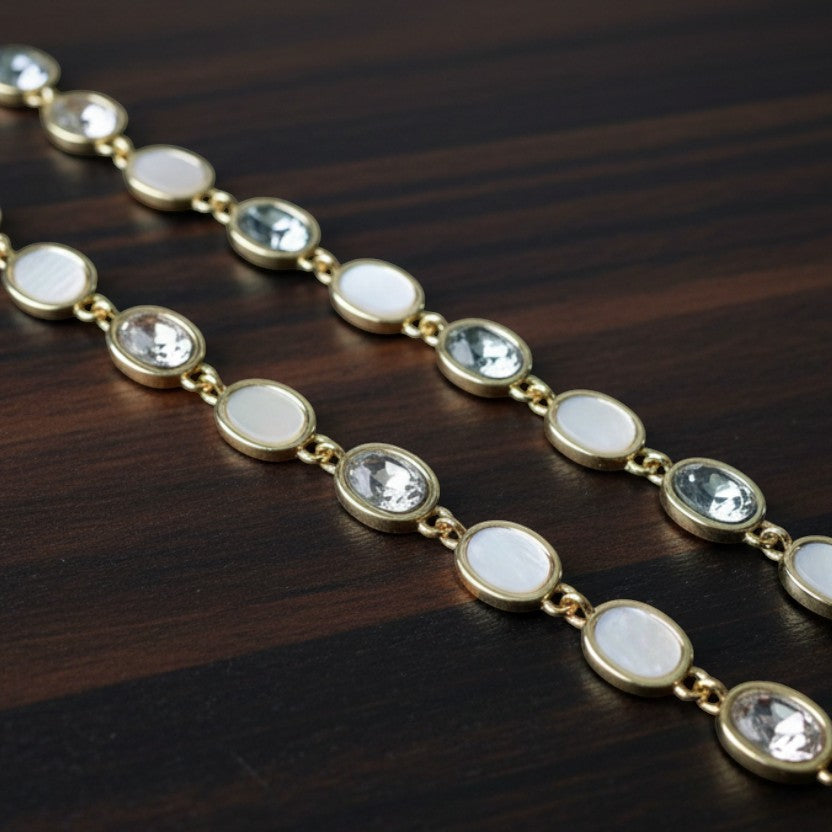 SVORA opal grey gemstone adjustable bracelet with gold-tone finish and good luck charm.