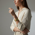 SVORA gold palm leaf cuff bracelet with intricate vein detailing, 18K gold plated stainless steel.