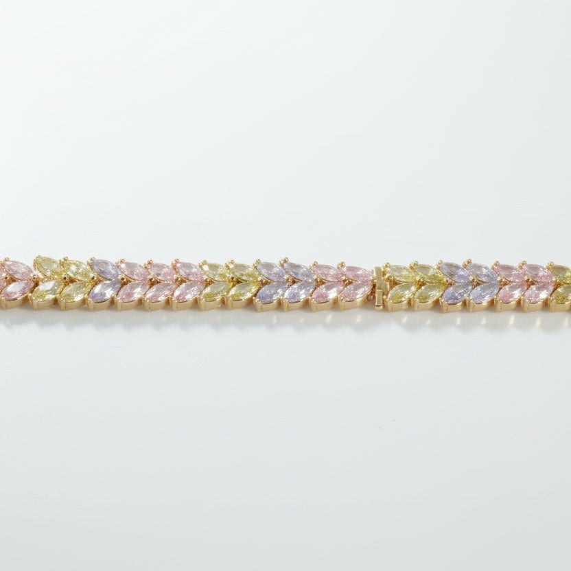 SVORA double row marquise CZ tennis bracelet in pastel pink, lavender, and yellow with alternating leaf pattern. 18K gold plated.