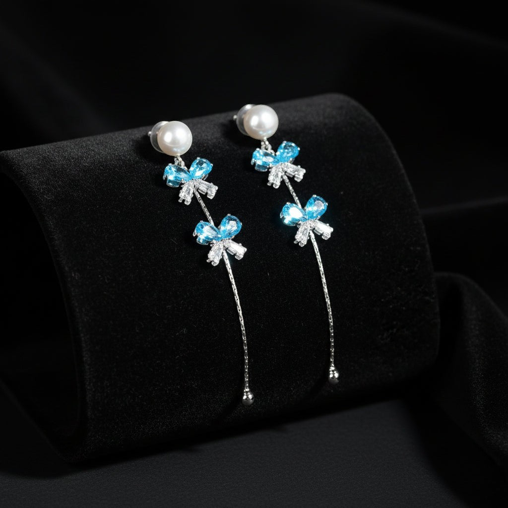 SVORA pearl stud aqua drop dangler earrings with blue crystal clusters and cubic zirconia accents.