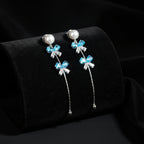 SVORA pearl stud aqua drop dangler earrings with blue crystal clusters and cubic zirconia accents.