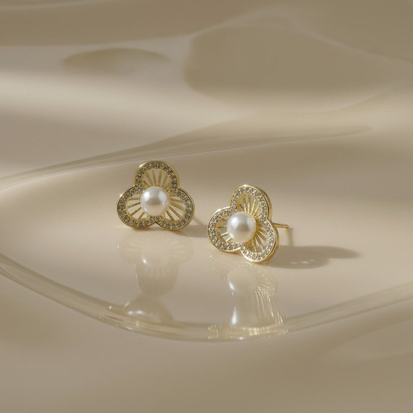 SVORA gold-tone stainless steel floral stud earrings with pearl center and crystal accents