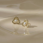 SVORA gold-tone stainless steel floral stud earrings with pearl center and crystal accents
