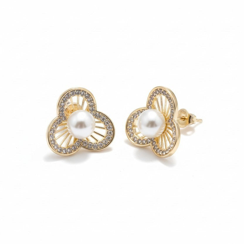 SVORA gold-tone stainless steel stud earrings with pearl and crystal accents in a floral design.
