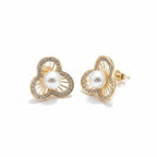 SVORA gold-tone stainless steel stud earrings with pearl and crystal accents in a floral design.