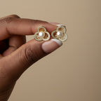 SVORA gold-tone stainless steel stud earrings with pearl center and crystal-embellished floral petals.